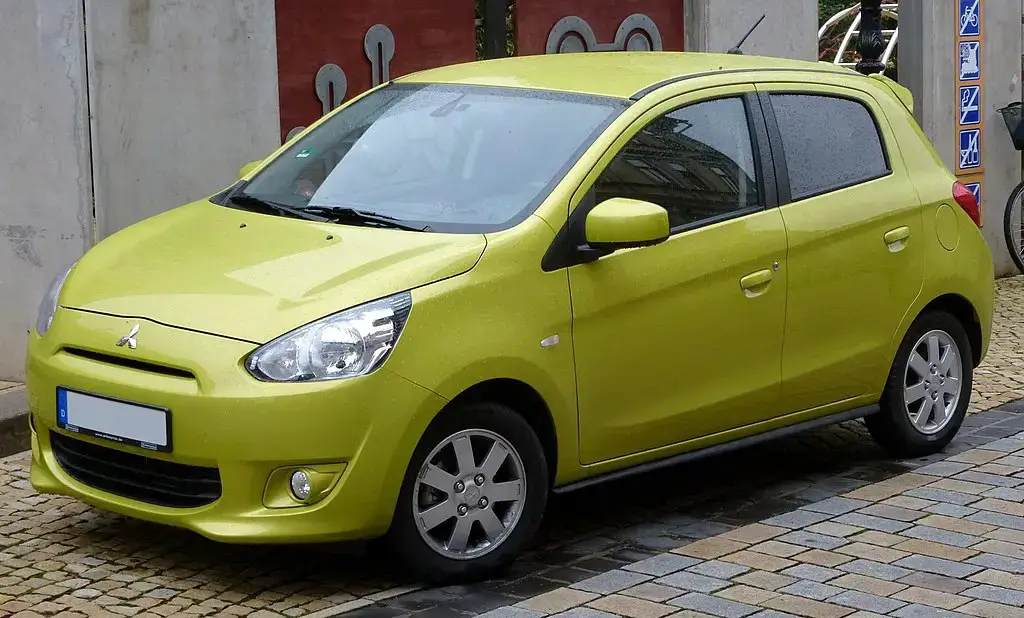 Mitsubishi Mirage A00 side front almostcarreviews